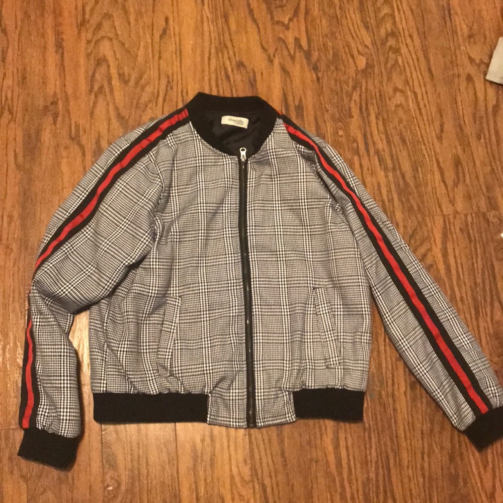 Black and white jacket with red striped sleeves